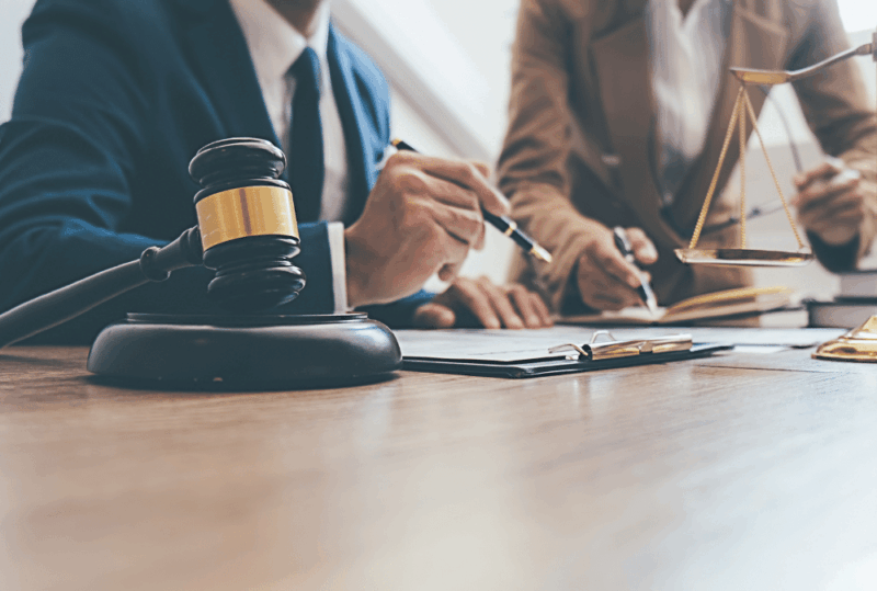 Image is of a lawyer working on a case with the help of a Seattle private investigator