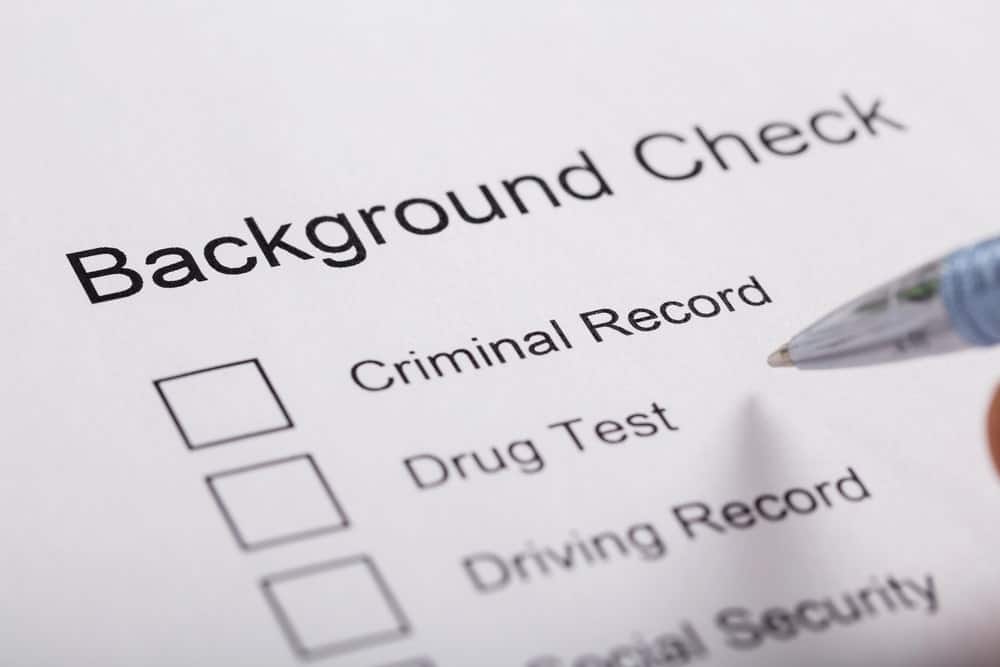 Image is of a close up view of a background check form with checkboxes, showing how criminal records may appear in WA background reports.